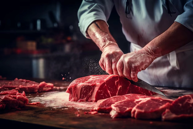 butcher-cutting-fresh-meat-pieces-close-up_1268-27932
